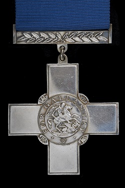George Cross medal on blue ribbon